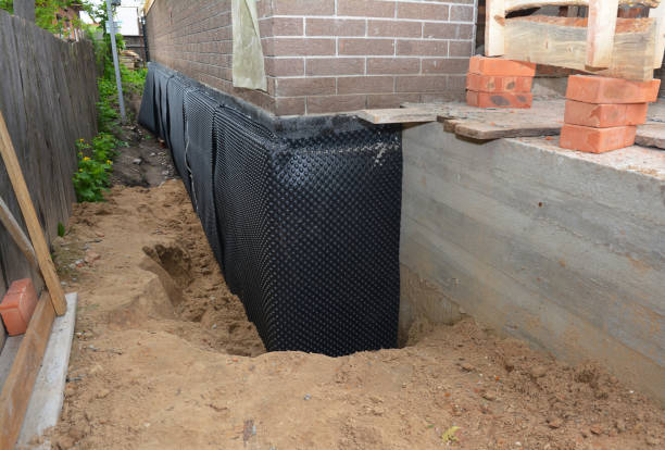 Happy homeowners after waterproofing job in Scottsville